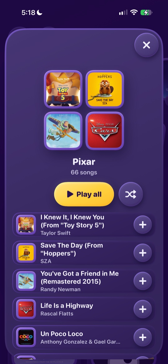The Pixar pack, open: four covers, a Play all button and a list of songs each with a plus button